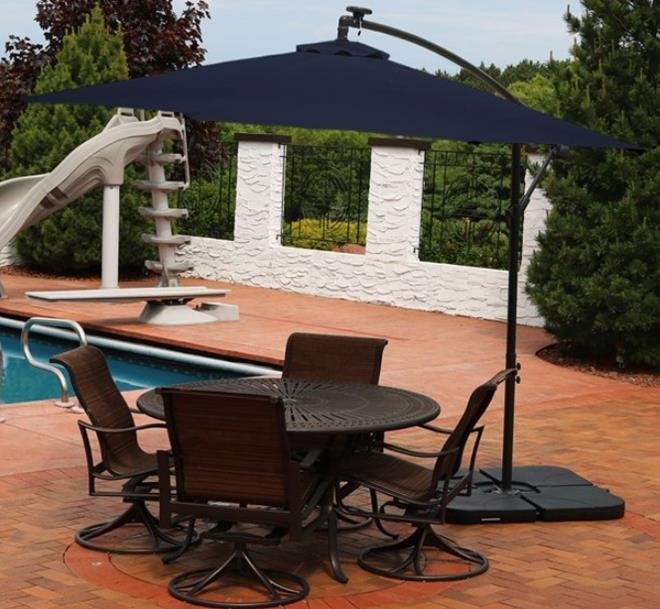 Sunnydaze Solar LED 10-Foot Offset Patio Umbrella with Cantilever, Crank, and Cross Base -Navy blue